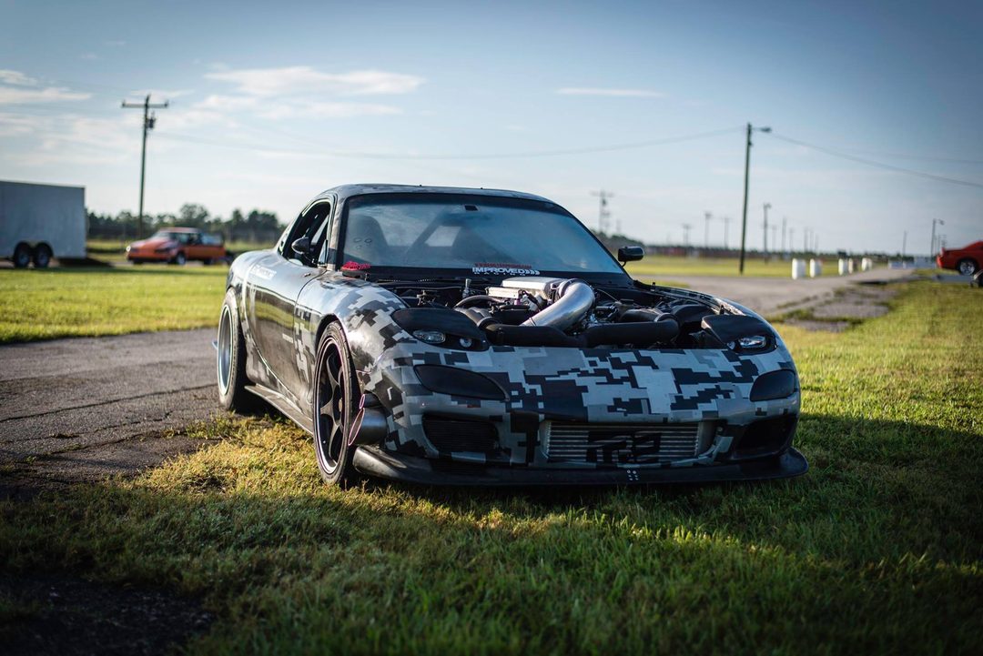 DigiCar RX-7 at the track at sunrise with the hood off